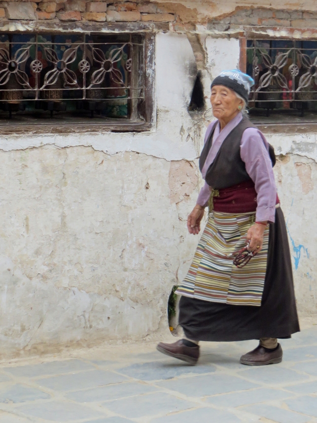 Tibetan ladies wear these beautiful rainbow-colored aprons, or pangden. 