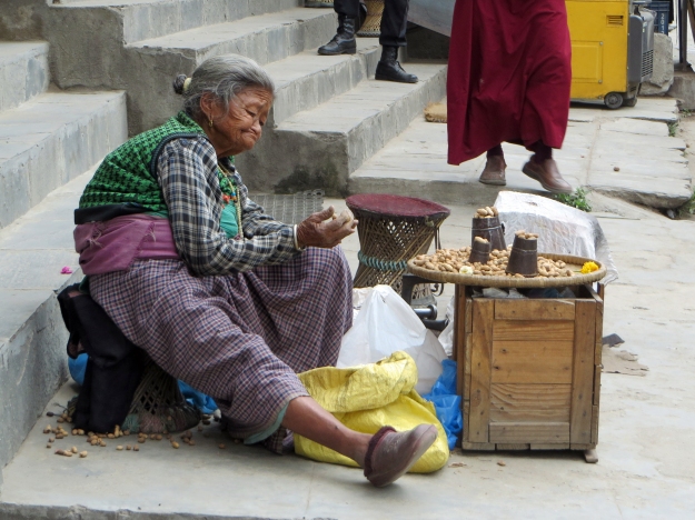 Every day, this lady sat by the main gate of the stupa selling peanuts,