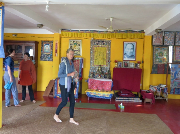 The yellow walls in the yoga room of Ganden Yiga Chozen were covered with beautiful THANGKA paintings, and big windows looked out onto the lake.