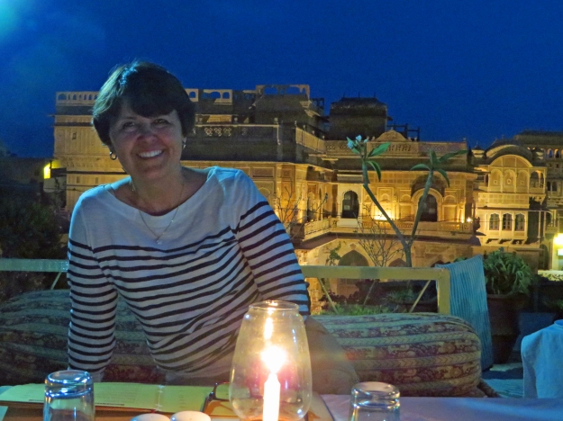 Elizabeth, enjoying a delicious dinner on the rooftop of Trio.  The Jaisalmer Fort is in the background.