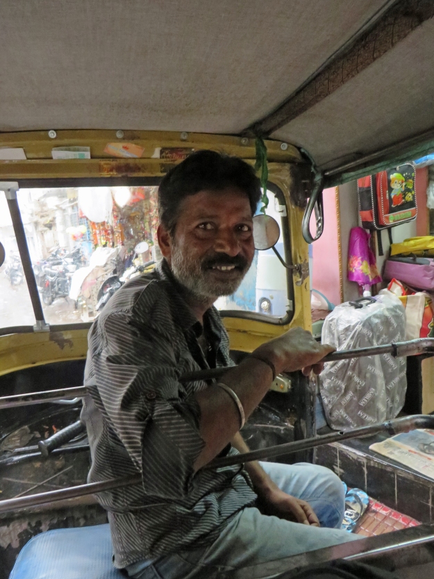 One of our favorite tuk-tuk drivers (and there were many), this guy picked us up in the middle of a driving rain, despite our being dressed in plastic bags.  He drove us to a roadside store and happily waited with us while a shopkeeper ran down the street o get us some umbrellas.