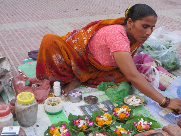 Vendors set up shop along the banks, selling flower offerings, fish food, snacks and so on.