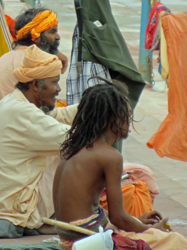 I shot this photo one early morning from the balcony of a chai house overlooking a small temple on the banks of the river.  These sadhus had just finished doing their laundry.