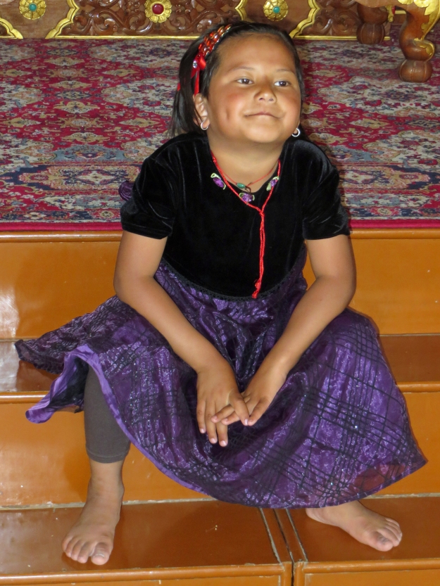 This little darling is waiting for her dad to take her photo at the Karmapa's Temple.  