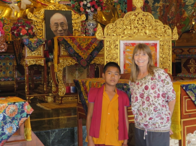 This young monk unlocked the temple at his monastery and gave us a private tour.  Like most temples, it was full of intricate carvings and paintings.